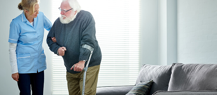 Caregiver Practicing Elderly Fall Prevention